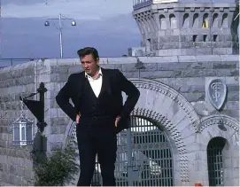  ?? (Submitted photo) ?? Singer Johnny Cash stands outside the east gate of Folsom State Prison before his first concert inside on Saturday, Jan. 13, 1968, in Folsom, California. The photo is one of 31 in an exhibition titled “1968: A Folsom Redemption” that opens Thursday, Nov. 10, 2022, at the Regional Arts Center in Texarkana, Texas. Cash historian Dr. Adam Long will deliver a related lecture Friday, Dec. 9, 2022, at the RAC.