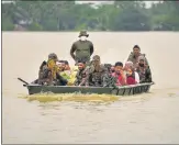  ?? REUTERS ?? Army personnel evacuate people from a flooded area in Hojai district of Assam on Saturday.