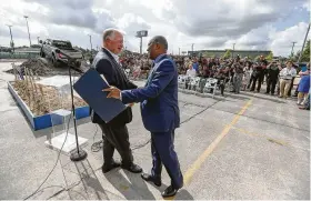  ?? Steve Gonzales / Staff photograph­er ?? Doggett Industries CEO Leslie Doggett, left, greets Mayor Sylvester Turner during the groundbrea­king of Doggett Ford’s $24 million, 62,000squre-foot dealership in north Houston on Thursday.