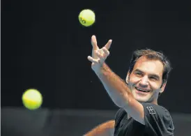  ?? /Reuters ?? Having a ball: Defending champion Roger Federer feels relaxed ahead of the start of the Australian Open in Melbourne.