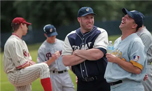  ?? MATT STONE / BOSTON HERALD ?? GOOD OLDTIME: Johnny Welch shares a laugh with Orazio Azzarello (right) during yesterday’s media day for the Oldtime Baseball Game, which will be played Aug. 22 at St. Peter’s Field in Cambridge.