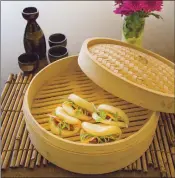  ??  ?? Chinese steamed pork buns with picked carrot and hoisin sause is one of the dishes served at Aromas.