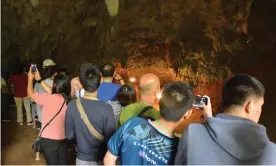  ??  ?? Visitors inside the Tham Luang Nang Non cave complex, where the 12 boys and their football coach were trapped for 17 days. Photograph: Chiang Rai Provincial Public Relations Office Handout/EPA