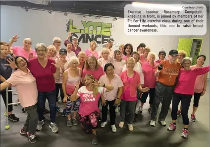  ?? Courtesy photo ?? Exercise teacher Rosemary Competelli, kneeling in front, is joined by members of her Fit For Life exercise class during one of their themed workouts, this one to raise breast cancer awareness.