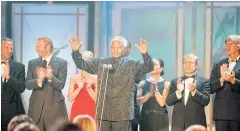  ??  ?? Nelson Mandela, centre, speaks in Monaco in 2000.