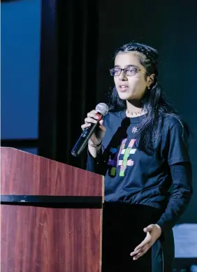  ?? PHOTO SUPPLIED ?? Fatima Mela takes the mic at her school’s WE Rise Above assembly.