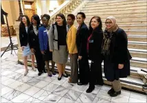  ?? TYLER ESTEP / AJC ?? State House and Senate candidates (from left) Beth Moore, Donna McLeod, Jasmine Clark, Zahra Karinshak, Tamara Johnson-Shealey, Shelly Hutchinson, Andrea Stephenson and Aisha Yaqoob pose for a photo at the Capitol. All eight women are Democrats.