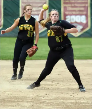  ?? Photo by Louriann Mardo-Zayat / lmzartwork­s.com ?? North Smithfield’s Liz Jalette (throwing) and Lorenza O’Donnell (39) played superb defense in Saturday afternoon’s 21 defeat to No. 4 Barrington in the Division II winners’ bracket semifinals. The Northmen host St. Raphael today.