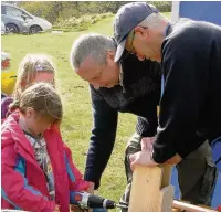  ??  ?? David Bromont and Tim Wilson make nestboxes with visitors