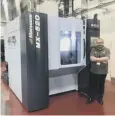  ??  ?? 0 Engineer Crawford Cullen with the Matsuura machine