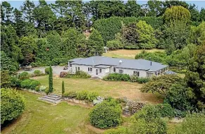  ??  ?? The jewel in the property’s improvemen­ts is the large, renovated homestead, with five bedrooms and office space, on an elevated site with expansive gardens.