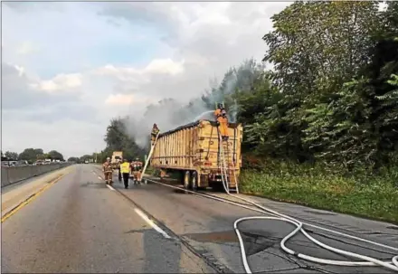  ?? SUBMITTED PHOTO — MARK J. WALSH/IRISHEYEZ PHOTOGRAPH­Y ?? A tractor trailer carrying residentia­l trash caught on fire Tuesday morning, delaying traffic on the Route 30 Bypass westbound lanes. Thorndale, Lionville and Coatesvill­e VA firefighte­rs responded to the incident.