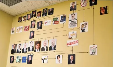  ?? ALI RAZA/METROLAND ?? "There is nothing criminal on the wall,’’ in his office washroom, Stouffvill­e mayor Justin Altmann said, referring to his mural of photos.