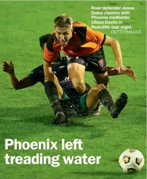  ?? GETTY IMAGES ?? Roar defender Jesse Daley clashes with Phoenix midfielder Ulises Davila in Redcliffe last night.