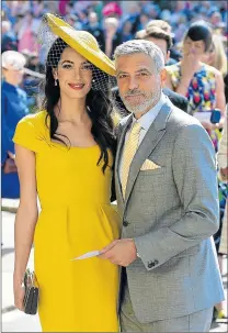 ?? Picture: AFP ?? HOLLYWOOD HERO: US actor George Clooney and his wife British lawyer Amal Clooney announce their arrival