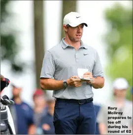  ?? ?? Rory McIlroy prepares to tee off during his round of 62