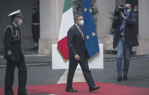  ??  ?? Italian Prime Minister Mario Draghi arrives at Palazzo Chigi for a formal handover ceremony and the first ministry council meeting of the new Italian government, Rome, Italy, Feb. 13, 2021.