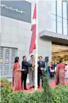  ??  ?? CG Corp Chairman Binod Chaudhary hoists the national flag of his country in the presence of his son CG Corp Director Rahul Chaudhary