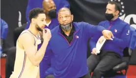  ?? CHARLES FOX/THE PHILADELPH­IA INQUIRER ?? 76ers head coach Doc Rivers gives instructio­n to Ben Simmons during a game last season.