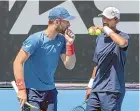  ?? AP ?? Michael Venus, left, talks with partner Raven Klaasen during their doubles loss yesterday.