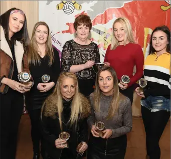  ??  ?? Boherbue figure dancers receiving their trophies from Margaret Whelan, secretary, Cork Scór . Photos: John Tarrant.