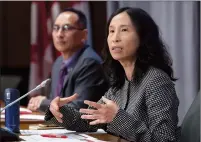  ?? CP PHOTO ADRIAN WYLD ?? Deputy Chief Public Health Officer Howard Njoo looks on as Chief Public Health Officer Theresa Tam responds to a question during a news conference Tuesday in Ottawa.