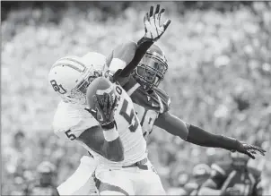  ?? Lake Fong/post-gazette ?? West Virginia’s Terence Garvin, right, and the rest of the Mountainee­rs defense is trying to forget Baylor’s 63-point output Saturday as they prepare to face Texas this week.