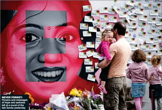  ??  ?? never forget: Flowers and messages of hope and sadness left at a mural of the late Savita yesterday