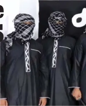  ??  ?? Terror cell: Clutching knives and a rifle, eight members of the group pose in front of an Islamic State flag in the video which emerged on social media last night. It included footage of the men pledging allegiance to Islamic State terror