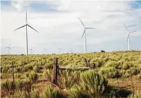  ??  ?? Wind turbines and cedar fence near Pecos, 2014