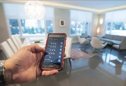  ?? PHOTOS: PETER McCABE ?? Heating, cooling, lighting and window shades are all controlled via an Android phone app at the home of Ghassan Cordahi.