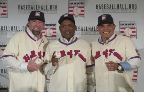  ?? PHOTO ?? In this Jan. 19 file photo, Hall of Fame inductees Jeff Bagwell (left) Tim Raines (center), and Ivan Rodriguez, poses for a photo during a news conference, in New York. AP