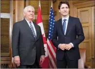  ?? CP PHOTO ADRIAN WYLD ?? Prime Minister Justin Trudeau and U.S. Secretary of State Rex Tillerson wait for photograph­ers to enter the room for a photo op at the start of a Tuesday meeting on Parliament Hill in Ottawa.