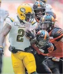  ?? CANADIAN PRESS FILE PHOTO ?? Running back C.J. Gable (2) is pursued by B.C. Lions’ Anthony Orange (26) and Jordan Herdman (53) during aCFL game on Aug. 9.