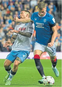  ?? ?? Borna Barisic fends off Napoli’s Matteo Politano during the Ibrox defeat and (below) Calvin Bassey up against Mo Salah at Anfield