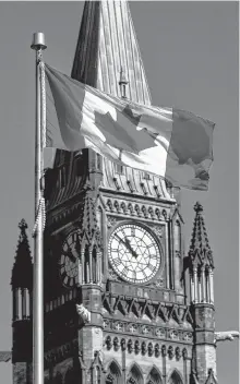  ?? REUTERS ?? A Canadian flag flies in front of the Peace Tower on Parliament Hill in Ottawa. A backlog of stalled bills in Parliament has observers predicting the partisan squabbling may lead to an early election.