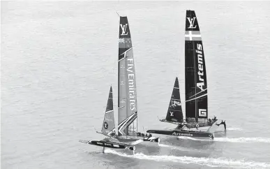  ?? Associated Press ?? In this photo provided by the America's Cup Event Authority, Emirates Team New Zealand, left, competes against Sweden's Artemis Racing on the second day of the best-of-nine America's Cup challenger finals Sunday on Bermuda's Great Sound.