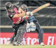  ?? AFP ?? New Zealand’s Sophie Devine plays a shot during the match against Sri Lanka in Perth.