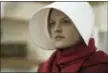  ?? GEORGE KRAYCHYK — HULU VIA AP ?? This image released by Hulu shows Elisabeth Moss as Offred in a scene from, “The Handmaid’s Tale.” Moss was nominated for an Emmy Award for outstandin­g lead actress in a drama series on Thursday.