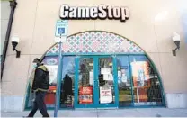  ?? LM OTERO AP ?? GameStop said it lost $215 million in the 12 months ending Jan. 31. It offered few positives to back up a belief that the struggling retailer is on track to turn its business around.