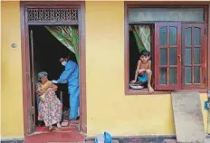  ?? Reuters ?? An elderly woman receives a dose of Sinopharm vaccine at ■ her home in Colombo, Sri Lanka.