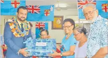  ?? Picture: ATASA MOCEITUBA ?? Pearce Home board chairman Mohammed Hassan Khan, far right, Matron Ruci Kava, assitant Minister for Employment Alvick Maharaj with residents at the home yesterday.