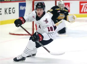  ??  ?? Tate Popple in action against the Brandon Wheat Kings this season. Keith Hershmille­r