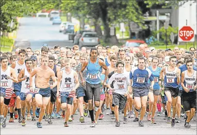  ?? Hearst Connecticu­t Media file photos ?? The Citizens Bank 5K Summer Fun Run takes place every July in downtown Middletown. Here, runners start the race on Court Street.