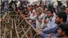  ??  ?? Protesters in Dhaka at a police barrier speak out against the DSA