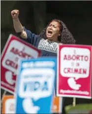 ?? AP PHOTO/NICK WAGNER, FILE ?? An abortion rights supporter chants outside the Supreme Court during a hearing related to a controvers­ial abortion case in Mexico City, Wednesday, June 29, 2016. Mexico’s Supreme Court held in 2021, that it was unconstitu­tional to punish abortion.