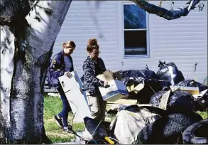  ?? Kristopher Radder / Associated Press ?? Federal agents execute a search warrant at Nathan Carman’s residence on Fort Bridgman Road in Vernon, Vt., after he was arrested on Tuesday and charged with killing his mother.