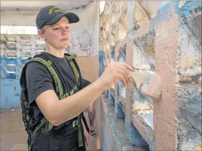  ?? SUBMITTED PHOTO ?? Sub-Lieutenant Brighid Woodman paints a classroom at Rebecca J. Wilson elementary school in Monrovia, Liberia, as part of Operation Projection exercise.