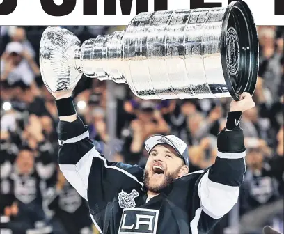  ?? Reuters ?? GOAL-DEN: Marian Gaborik hoists the Stanley Cup after the Kings’ 3-2 double-overtime and seasonendi­ng victory over the Rangers in Game 5 of the Stanley Cup finals Friday night. Gaborik scored the tying goal in the third period.