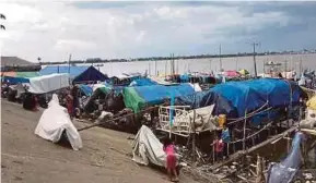  ??  ?? A fishermen’s village in Cambodia — the scene of a ‘korban’ activity on Friday. The fishermen live in their boats with all their earthly belongings.